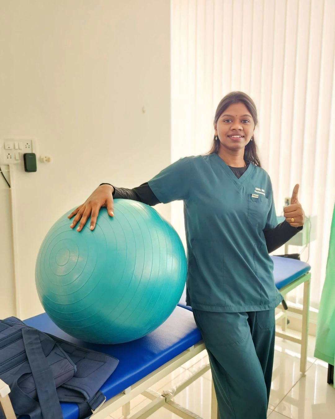 Doctor treating back pain at Curis 360 Physiotherapy Uttarahalli